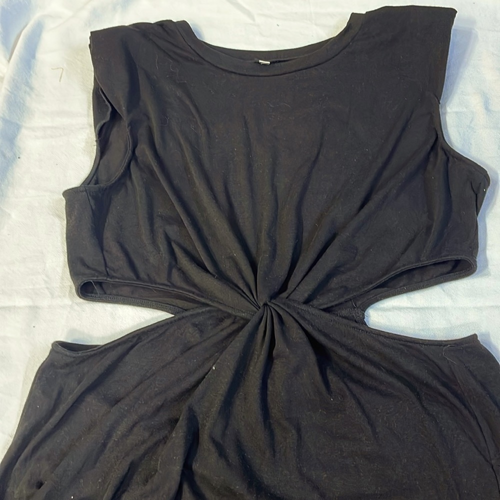 Side cutout maxi dress with padded shoulders and dual side splits.